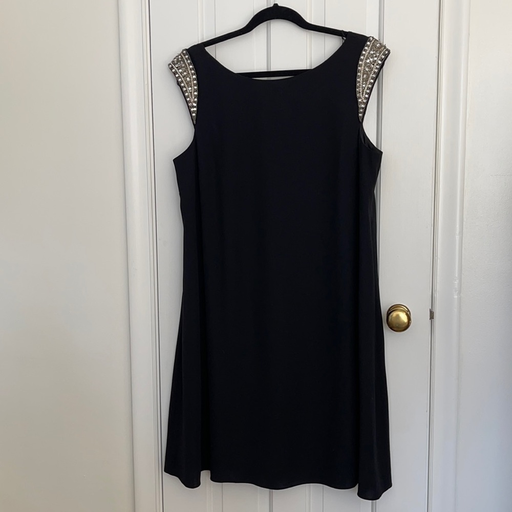 Cocktail black dress. Very flattering. Knee length